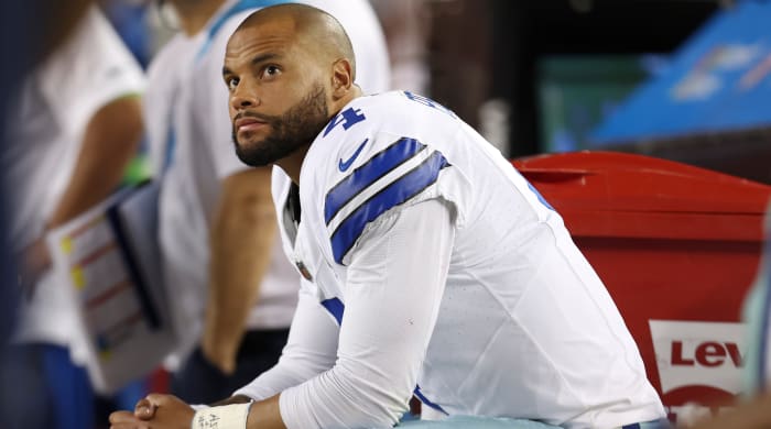 Cowboys quarterback Dak Prescott sits on the bench during a loss to 49ers